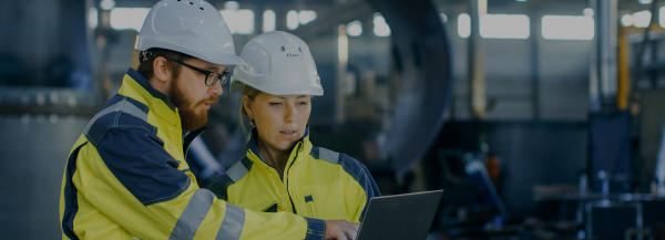 two blue collar workers in a meeting