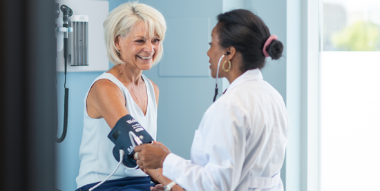 a healthcare professional taking blood pressure