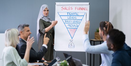 sales trainer teaching sales professionals with graphic