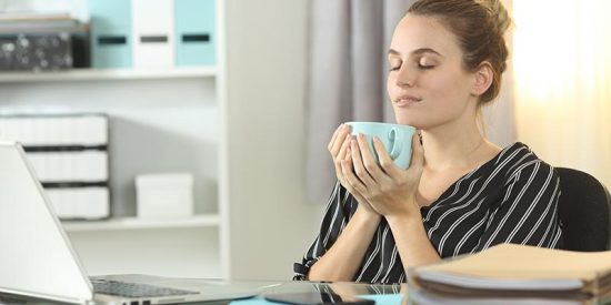 woman enjoying cup of coffee showing good well-being