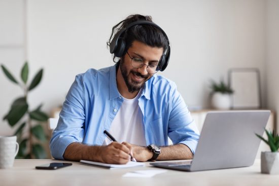 Employee takes a personalized training course at their desk.